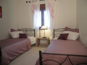First Bedroom with two single beds